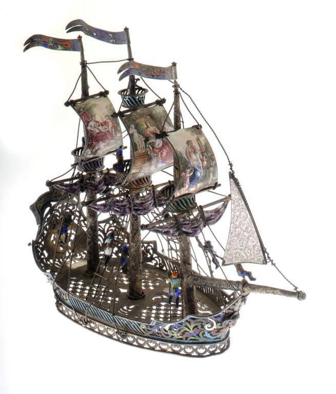 A VIENNESE SILVER GILT AND PAINTED ENAMEL NEF  as a three masted ship with billowing sails painted