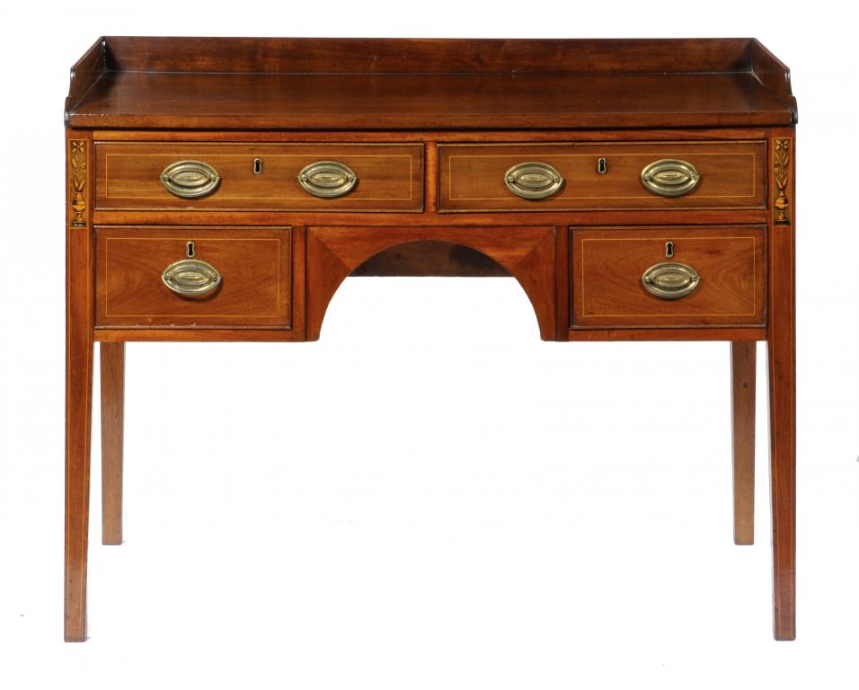 A VICTORIAN  MAHOGANY WASHSTAND  fitted four drawers about the arched apron, on square tapered