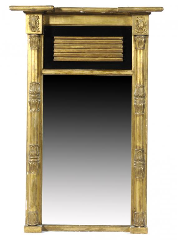 A GEORGE IV GILTWOOD MIRROR  with breakfront pediment, appliqués and lappeted pilasters, 119 x