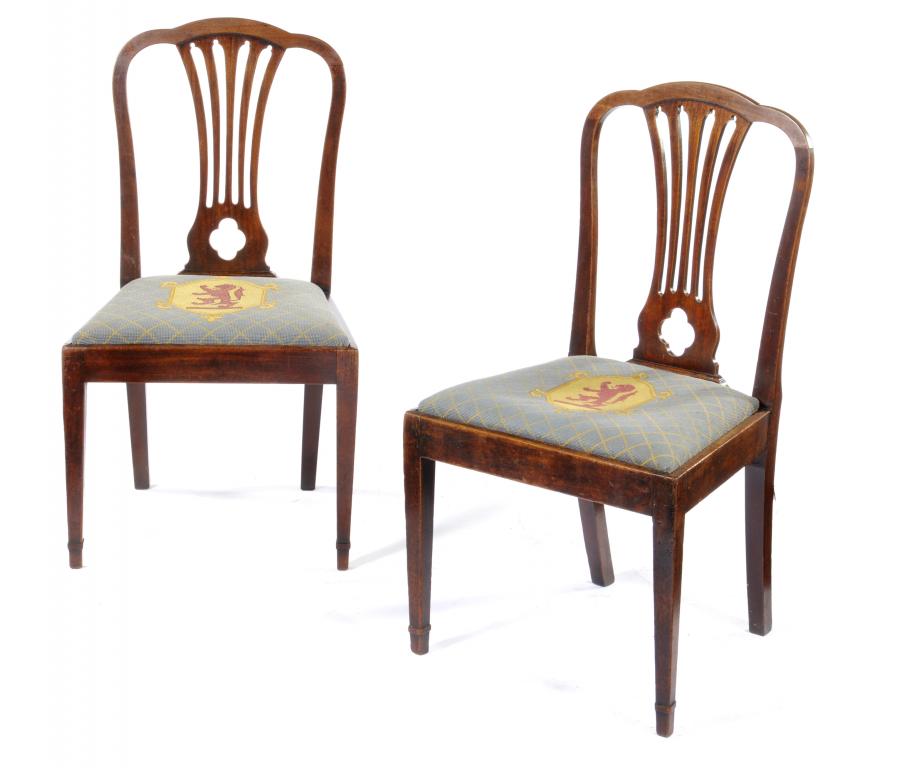 A PAIR OF GEORGE III MAHOGANY DINING CHAIRS  with pierced splat, the slip seat covered in blue