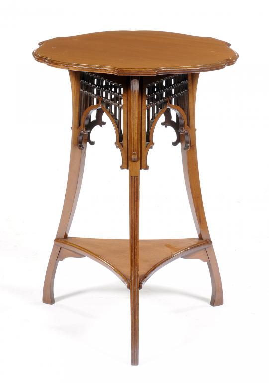 A VICTORIAN WALNUT OCCASIONAL TABLE in Moorish style, with pierced spandrels to the three