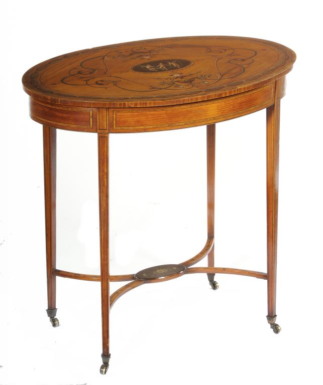 AN EDWARD VII PAINTED SATINWOOD TABLE  the oval top with a medallion of three children, urns and