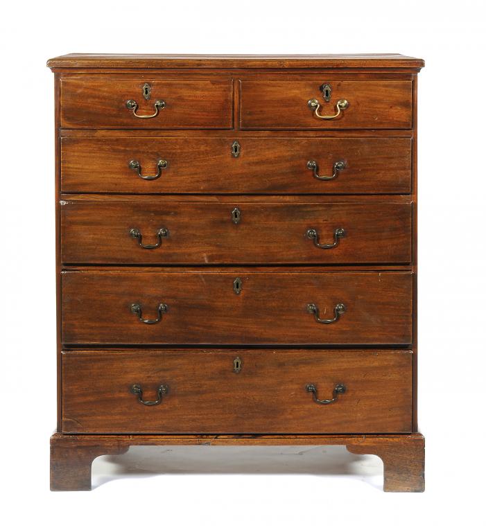 A GEORGE III MAHOGANY CHEST OF DRAWERS fitted two short and four graduated, moulded drawers, on