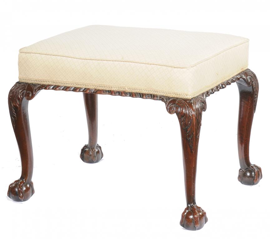 A VICTORIAN MAHOGANY DRESSING STOOL  with gadrooned rail, the cabriole legs carved with acanthus