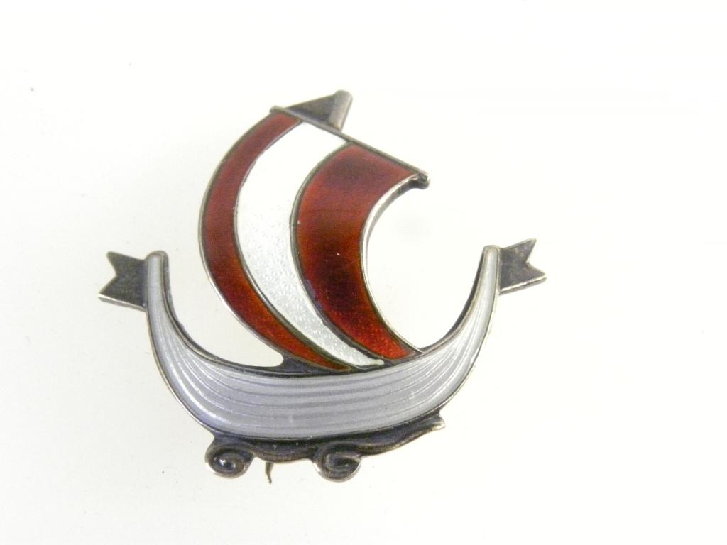 A NORWEGIAN SILVER AND ENAMEL LONGSHIP BROOCH BY AKSEL HOLMSEN