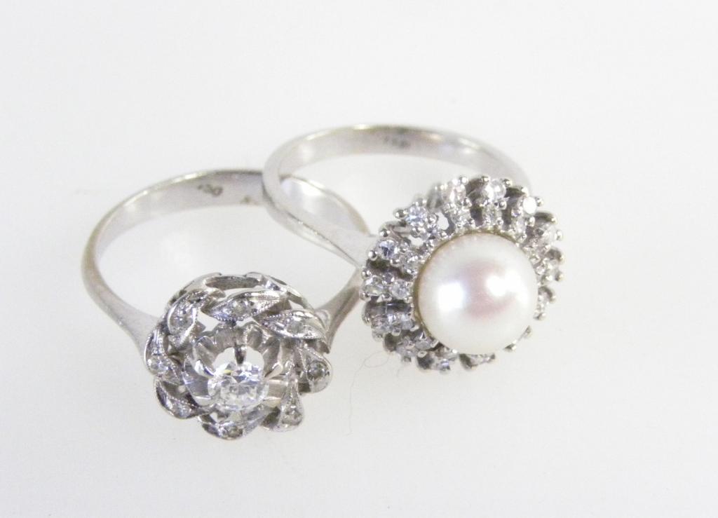 A CULTURED PEARL AND DIAMOND CLUSTER RING AND A DIAMOND CLUSTER RING, BOTH IN WHITE GOLD, BOTH