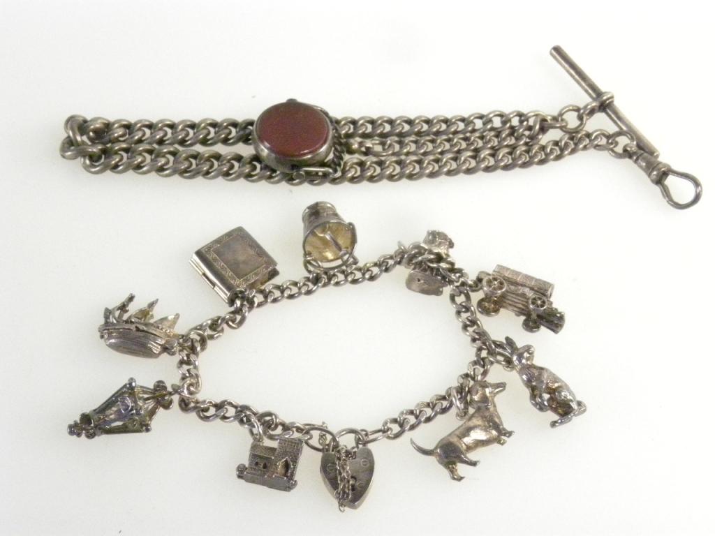 A SILVER ALBERT AND A SILVER CHARM BRACELET, 3 OZS