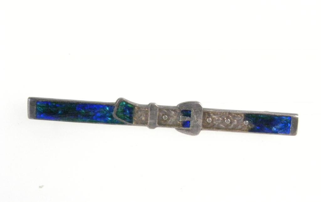 A CHARLES HORNER SILVER AND TRANSLUCENT ENAMEL BAR BROOCH DESIGNED AS A BELT AND CLASP, CHESTER 1911