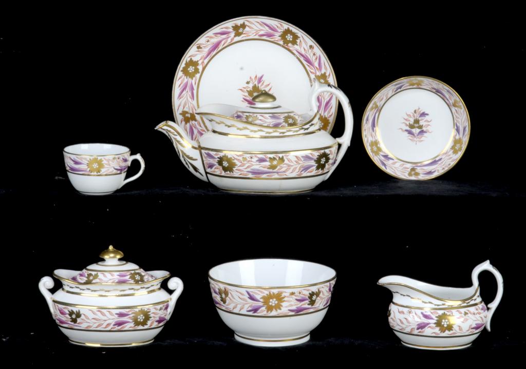 A MILES MASON TEA SERVICE in pattern 422, with a wide band of puce, red and gilt trailing foliage,