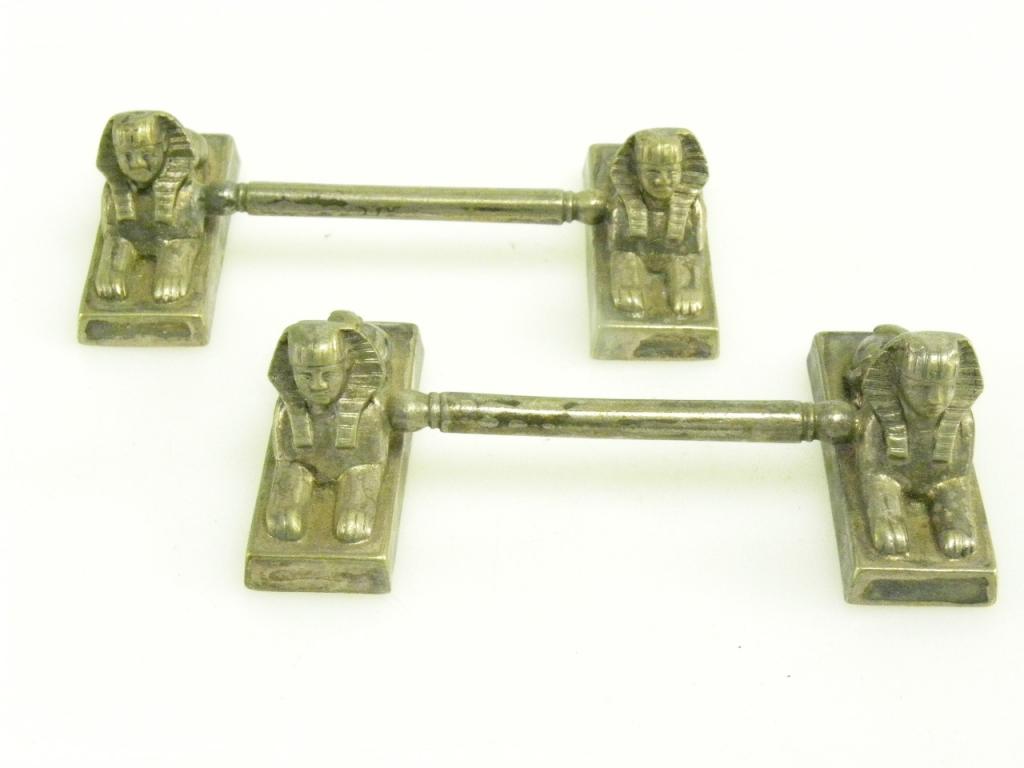 A PAIR OF VICTORIAN EPNS EGYPTIAN REVIVAL KNIFE RESTS OF SPHINX DESIGN, C1870