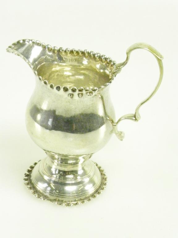 A GEORGE III SILVER CREAM JUG OF OGEE SHAPE WITH CRIMPED RIMS, LONDON 1770, 2OZS 10DWTS