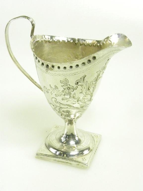 A GEORGE III SILVER CREAM JUG OF HELMET SHAPE, ON SQUARE FOOT, LATER CHASED, LONDON 1793, 3OZS