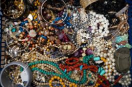 A quantity of costume jewellery beads and bangles