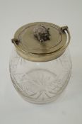 A silver plated and cut glass biscuit barrel