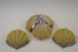 Set of three yellow glass shell lampshades (including two wall mantles)