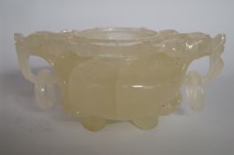 An oriental carved hardstone two handled bowl