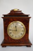 An early 20th century burr walnut veneer 8 day mantel clock