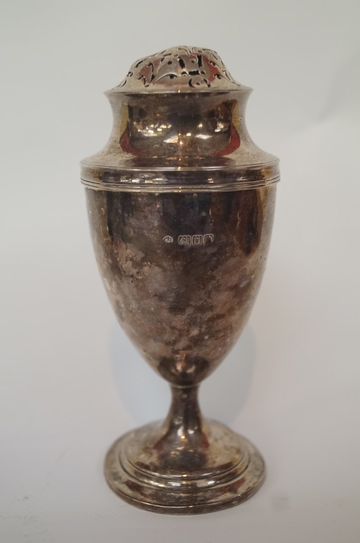 A silver sugar caster, by William Comyns, of pedestal vase form, 15.5cm tall; approximately 121