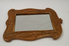 An Art Nouveau style pine mirror