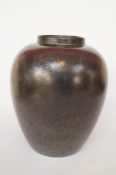 A decorative Poole pottery vase