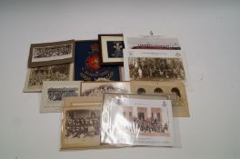 Approximately a dozen military band photographs and two band signs, mounted