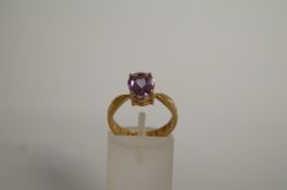An amethyst single stone 9ct gold dress ring, finger size M
