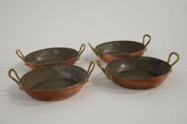 Four small copper pans