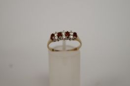 A garnet and cubic zirconia 9ct gold dress ring, finger size Q