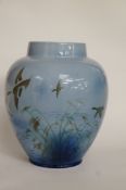 A Sylvac vase decorated with flying birds
