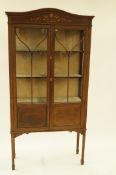 A glazed Edwardian mahogany display cabinet