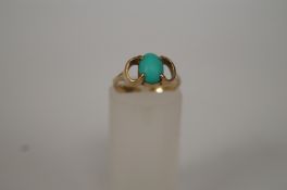 A single stone turquoise 9ct gold ring, finger size I 1/2