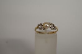 A cultured pearl and diamond 9ct gold, finger size O 1/2