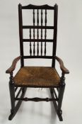 A 19th century elm rocking chair