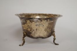 A silver sugar basin, Barker Brothers, Chester 1926, the bowl with cut rim, on three supports; 10.