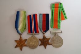 Four WW2 medals on ribbons