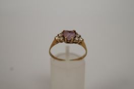 An amethyst and cubic zirconia 9ct gold ring, finger size Q 1/2