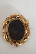 A Victorian mourning brooch, the central hair panel reversible, 4.7cm across