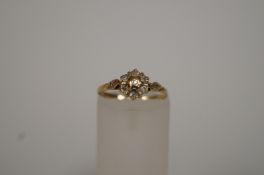 A seven stone 9ct gold diamond cluster ring, set with single cuts, finger size L