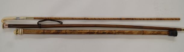 Three walking sticks with part ivory tops