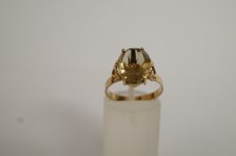A smokey quartz 9ct gold ring, finger size P