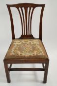 A George III mahogany dining chair with drop in needle seat