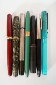 A Waterman silver twist pen, a Montblanc pen and five others