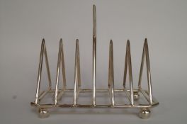 A copy of a toast rack designed by Christopher Dresser, 17.5cm long