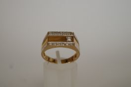 A gents 9ct gold diamond set ring, the one brilliant cut and twelve single cuts totalling
