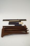 Six Victorian cast iron shelf brackets and three early slide rules