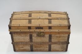 A pine chest with metal details, high domed top