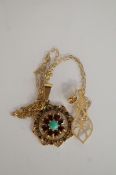 A turquoise and garnet 9ct gold pendant pendant on a chain, with a pair of earrings, cased