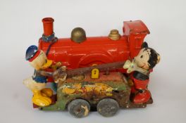 Mickey and Minnie Mouse 1935-40 seesaw figure and a similar period 'Puffing Billy' toy