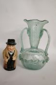 A two handled glass vase and a Royal Doulton character jug