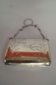 A silver purse, maker F. D., Birmingham 1920, engraved with flora and a bird, on a chain, 8cm long